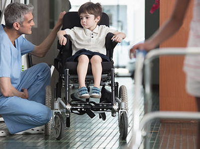 Doctor-Talking-to-Boy-in-Wheelchair 1